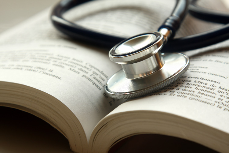 Close-up of a stethoscope on a book.