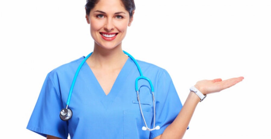 Registered Nurse wearing scrubs and holding arm up in look here gesture